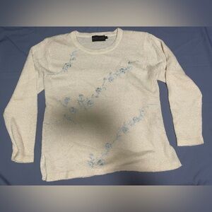 Elegant Cream Sweater with Blue Floral Accents